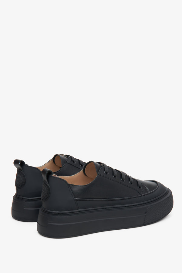 Women's black Estro sneakers with lacing on a thick sole.