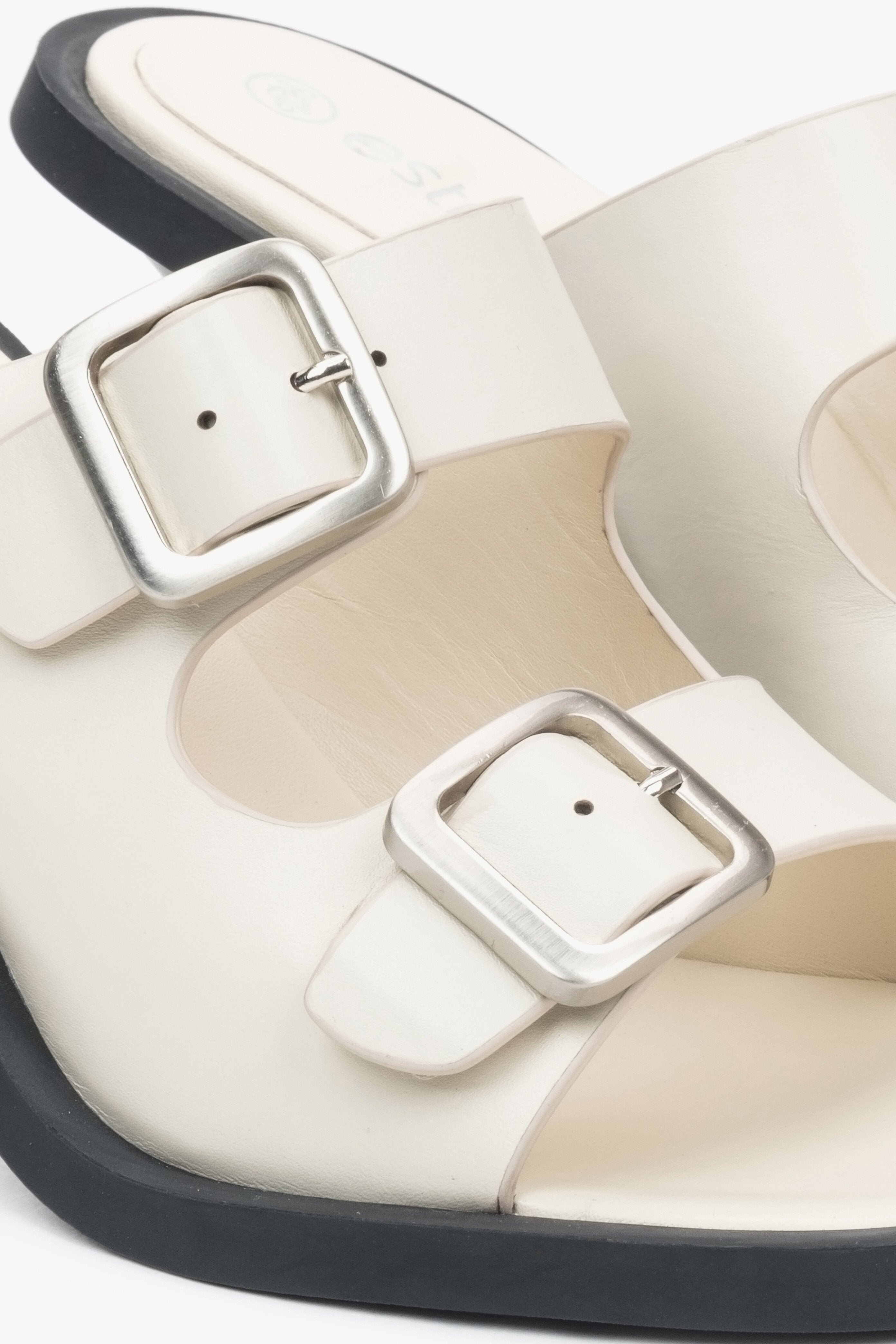 Women's white leather  mules by Estro - close-up of the buckle.