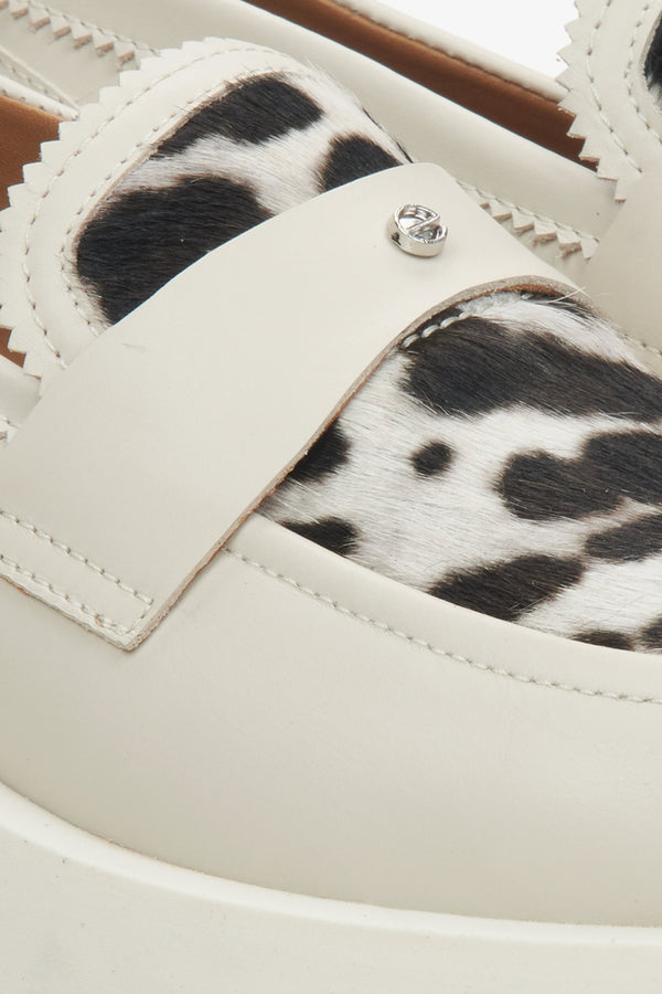 Women's light beige loafers Estro with a leopard print - close-up on the detail.