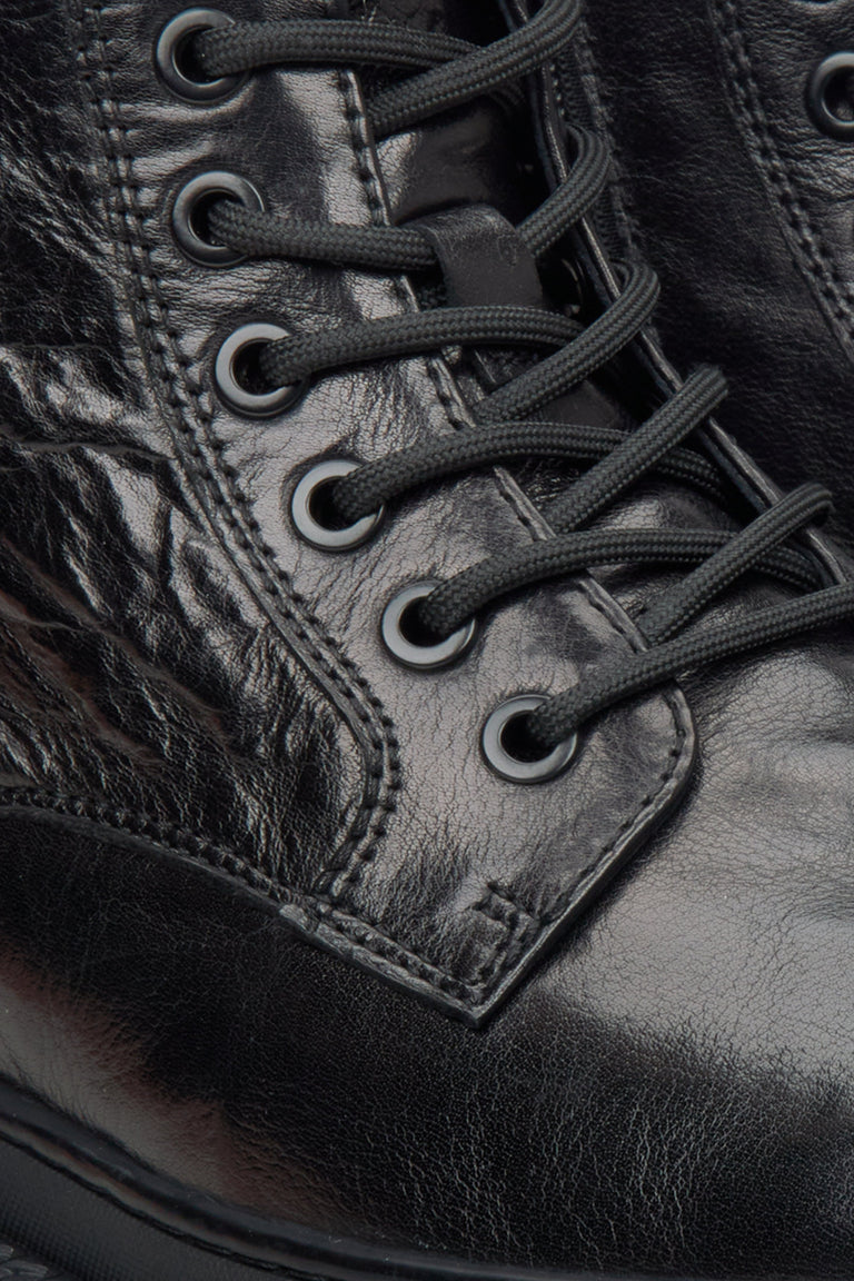 Men's black boots by Estro made of patent genuine leather - close-up on details.