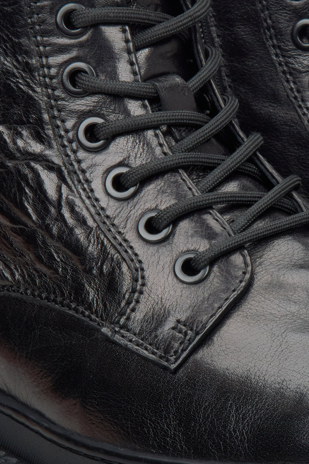 Men's black boots by Estro made of patent genuine leather - close-up on details.