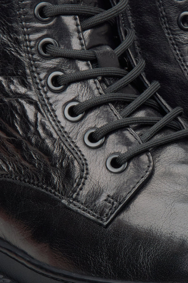 Men's black boots by Estro made of patent genuine leather - close-up on details.