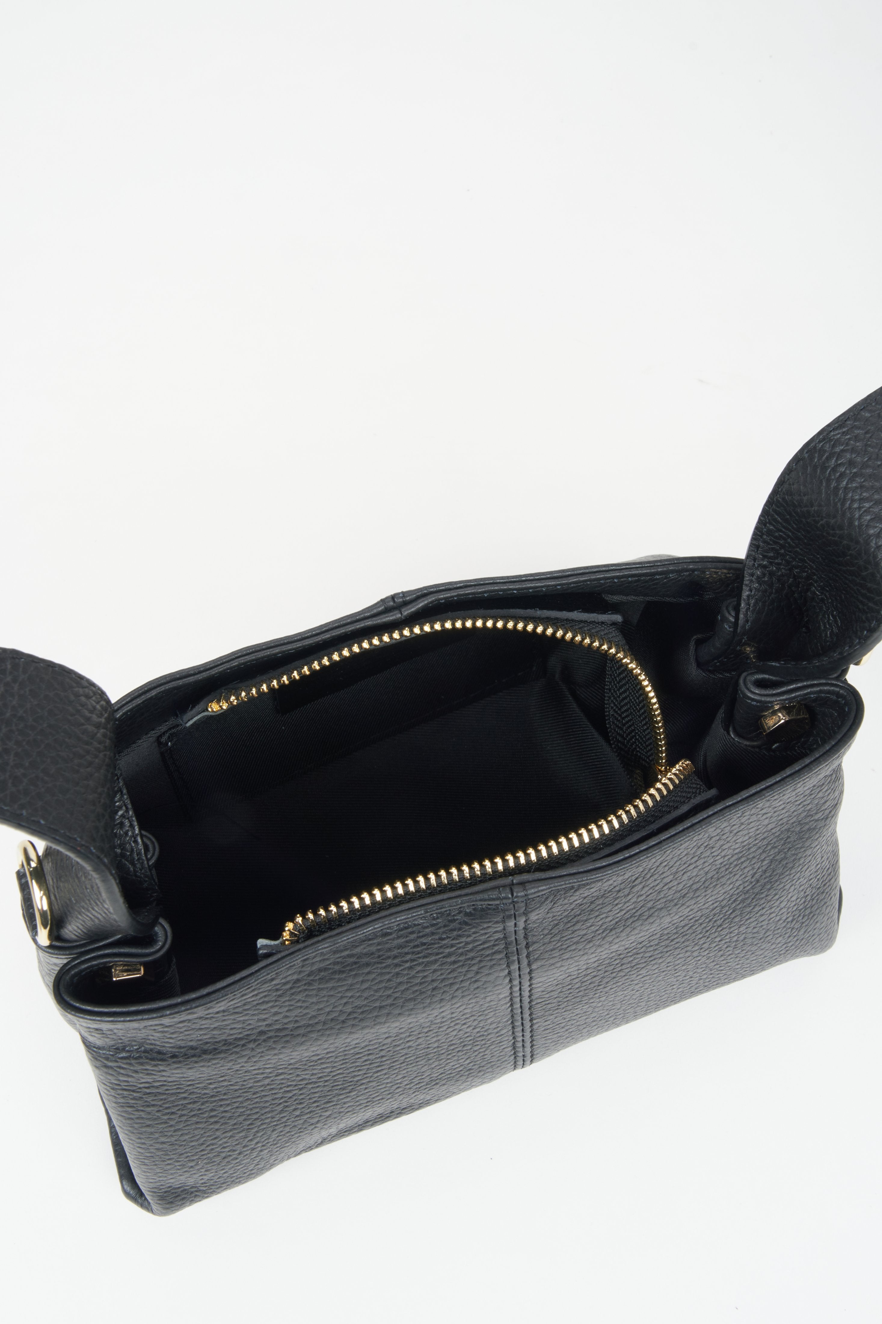 Women's handbag by Estro in black - close-up of the interior.