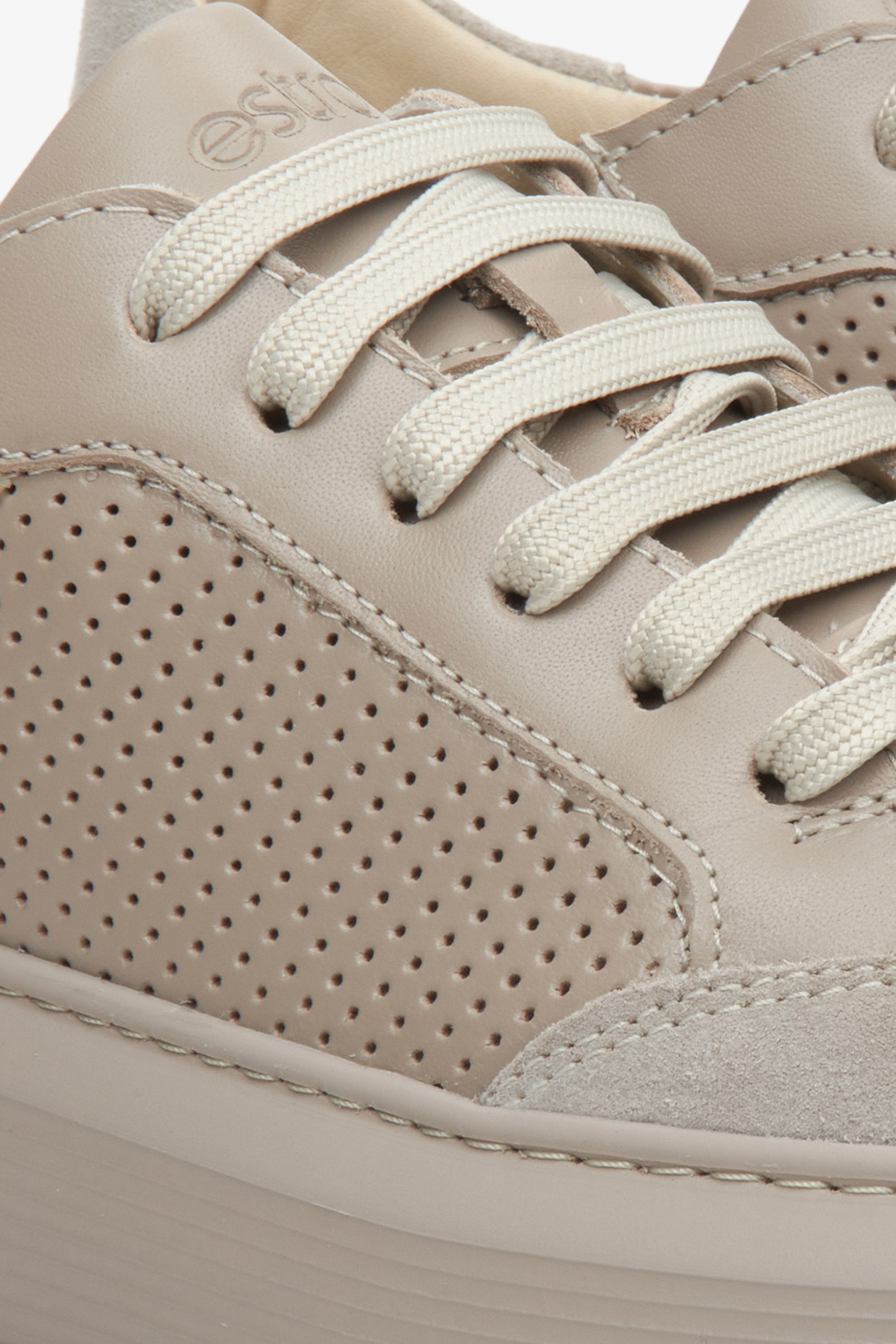 Women's beige fall sneakers with perforation, crafted from genuine leather and suede - close-up on the details.