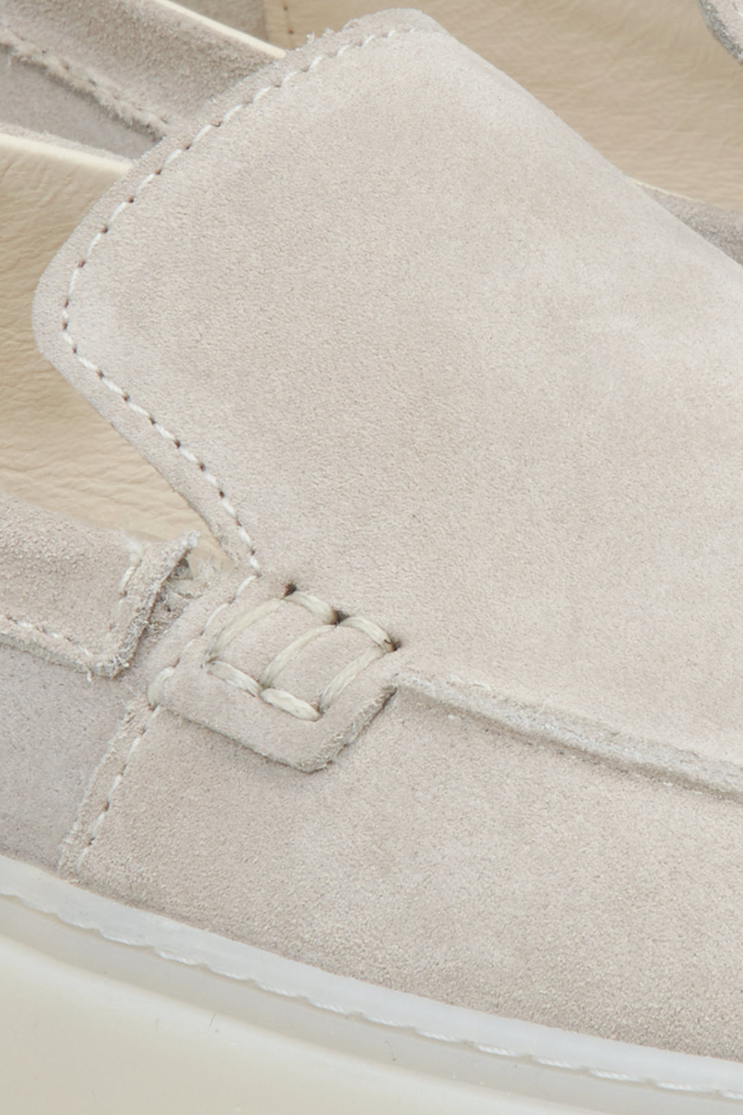 Light beige velour women's loafers - a close-up on details.