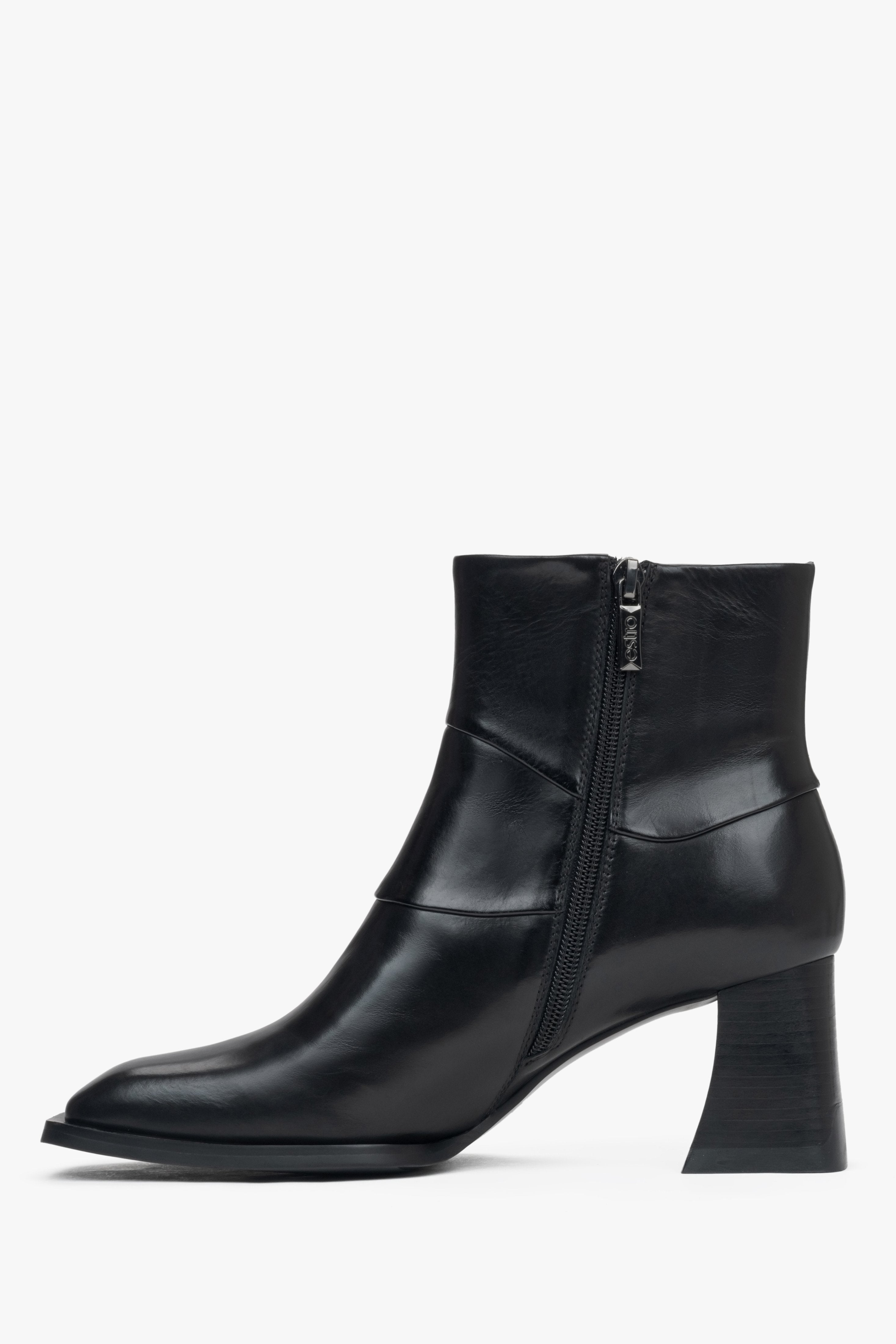 Women's ankle boots with a stable block heel made of black natural leather by Estro – side view of the shoe.