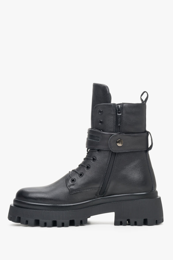 High, women's black  winter ankle boots on a platform by Estro - close-up of the shoe profile.