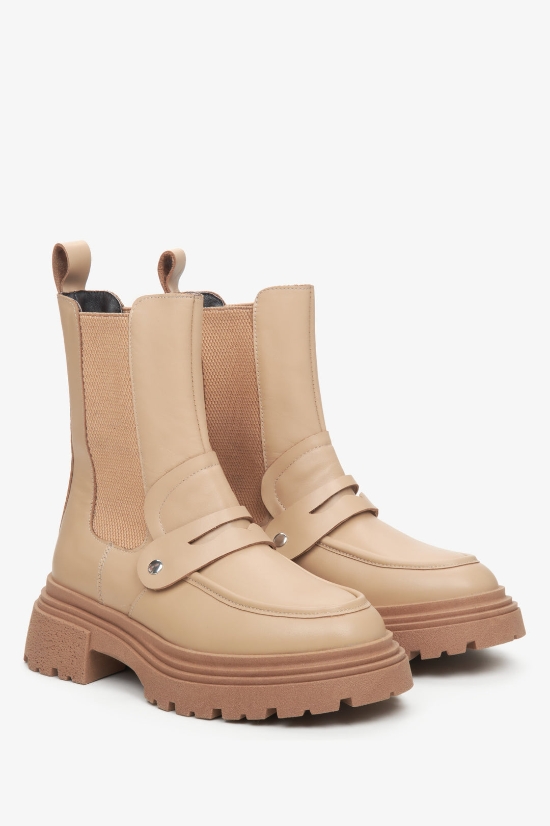 Women's beige leather Chelsea boots by Estro with embellishment.
