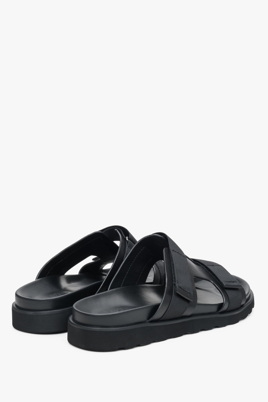 Men's black leather sandals with textile elements - close-up on the toe line and heel line.
