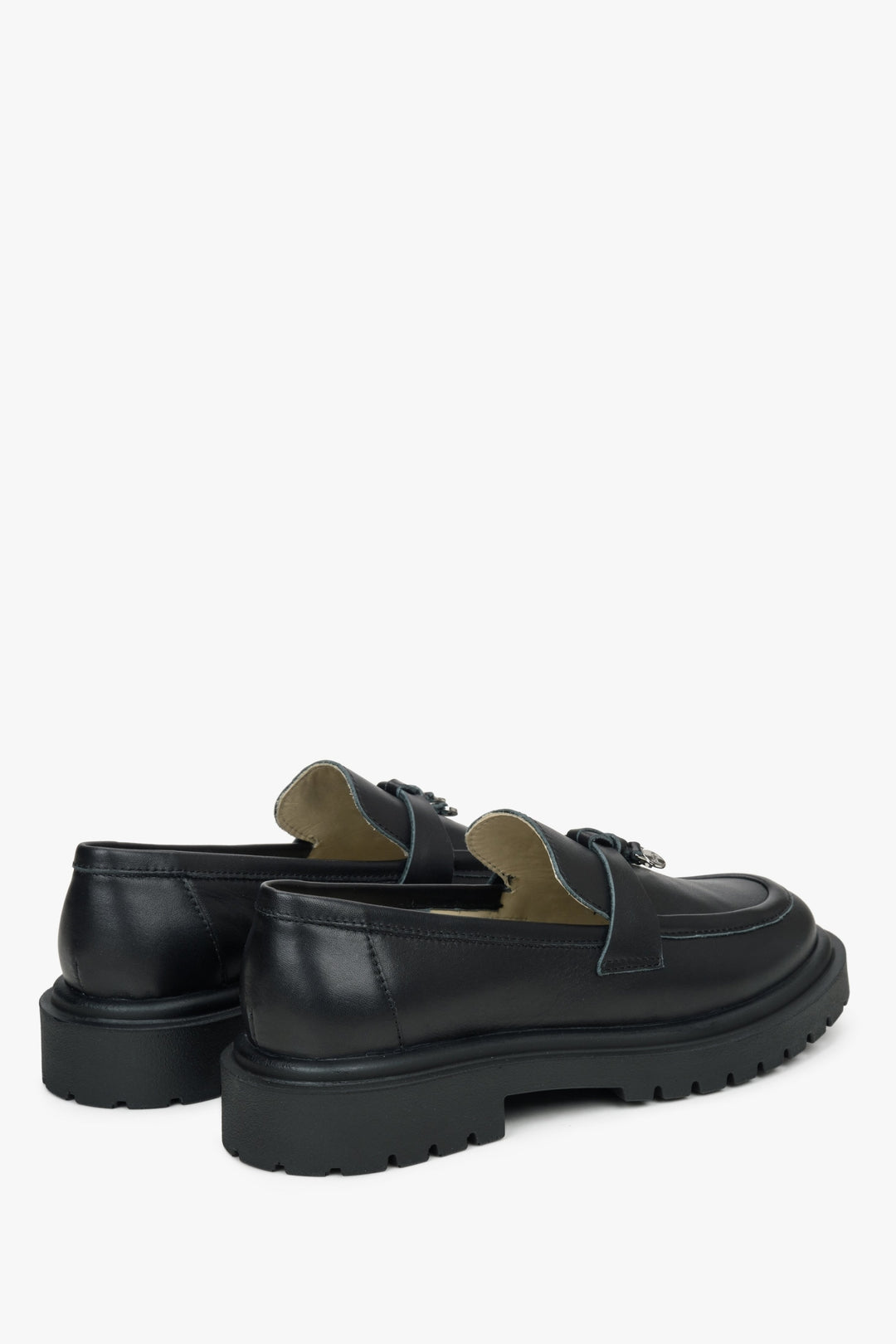 Women's black leather loafers by Estro - close-up of the heel counter and side profile of the shoe.