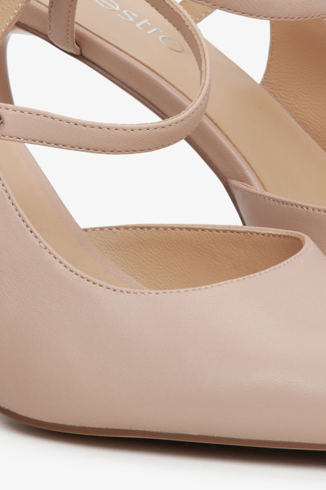 Women's beige slingback heels with a pointed toe - a close up on detaiks.