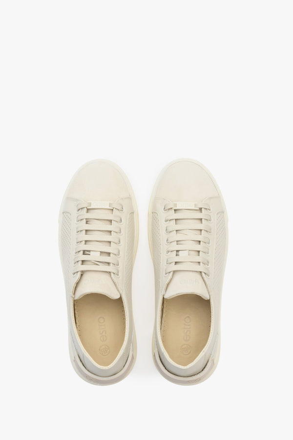 Women's beige leather sneakers with perforation - presentation of the footwear from above.