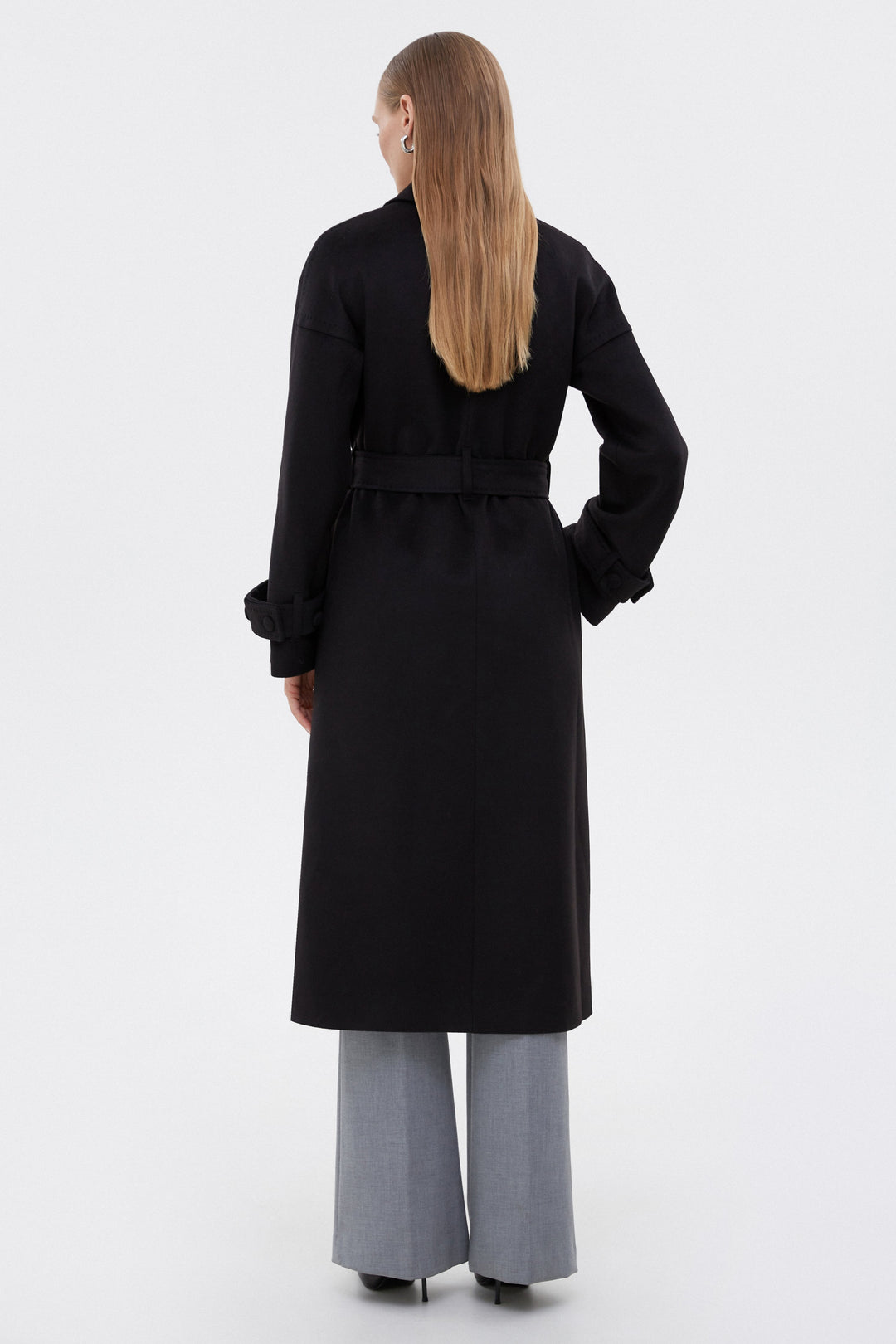 Classic black women's coat by Estro - back view of the model.