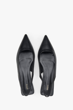 Elegant women's black slingback sandals with a pointed toe and flat heel.