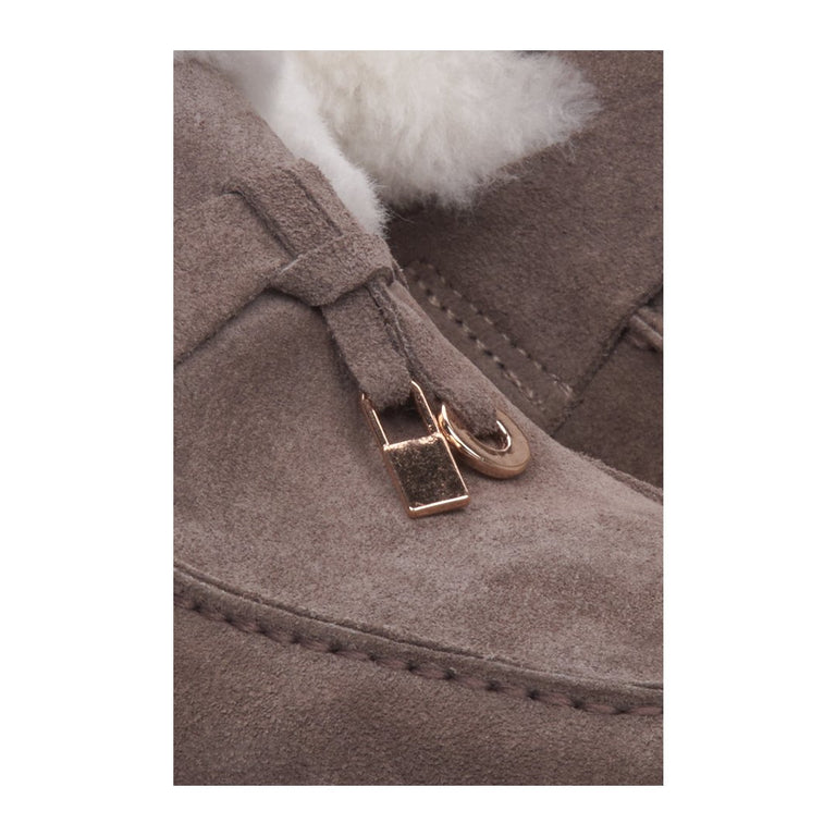 Estro women's winter moccasins made from genuine suede leather with a gold accent.