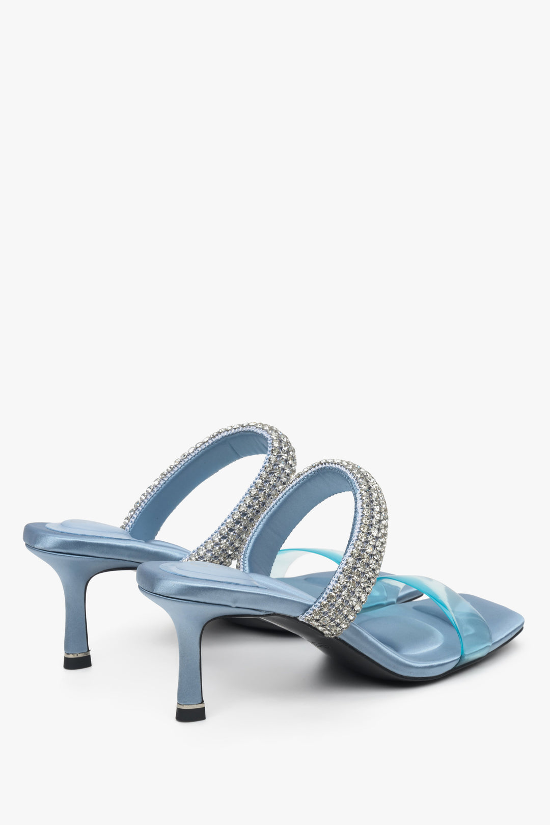 Women's blue stiletto slide sandals with zirconia, Estro brand - close-up on heels and heel line.