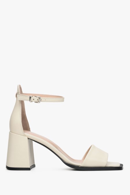 Women's beige sandals with a block heel - shoe profile.