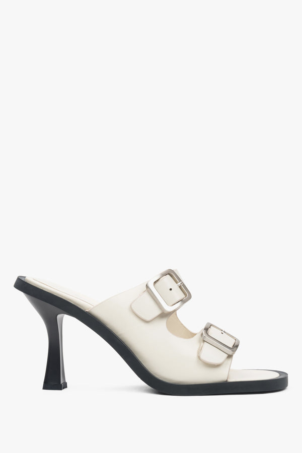 Women's leather white mules with a buckle from Estro - shoe profile.