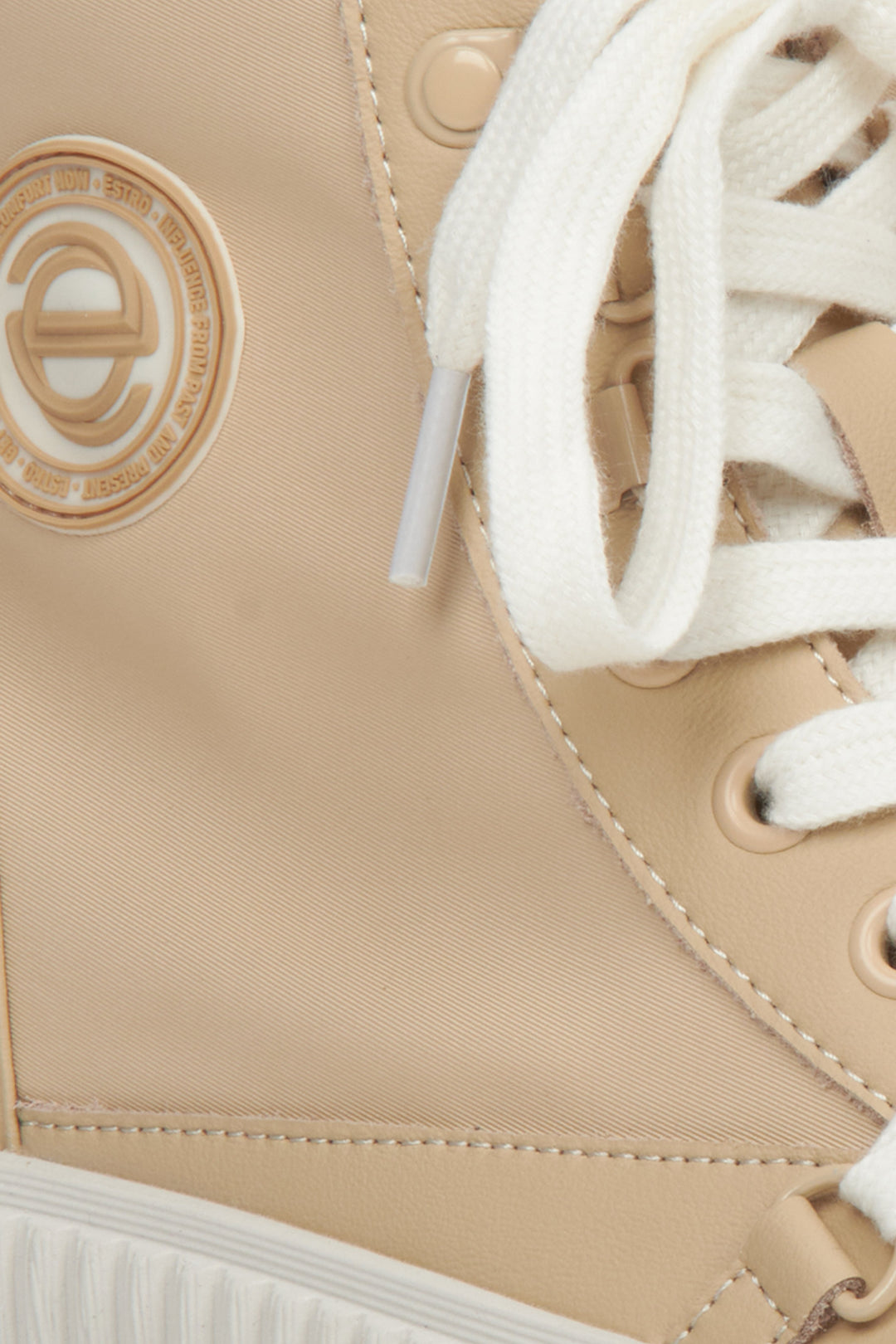 Women's beige leather sneakers by Estro - close-up on details.