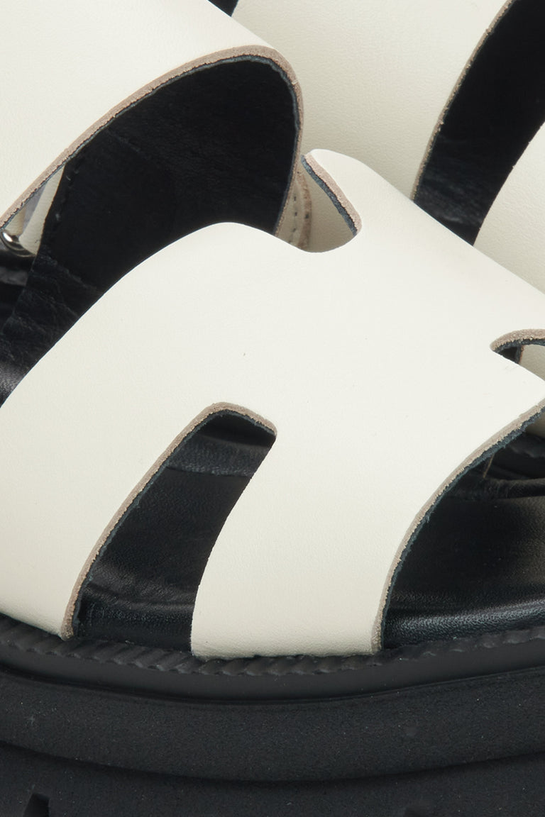 Women's white leather sandals by Estro - close-up detail.