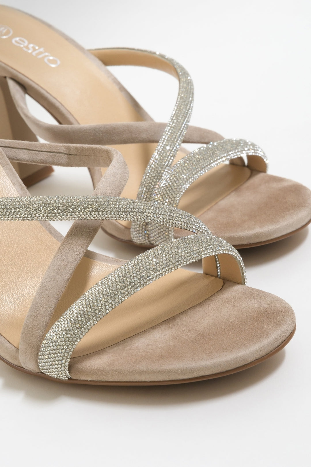 Stylish heeled sandals made of beige velour with zirconia.