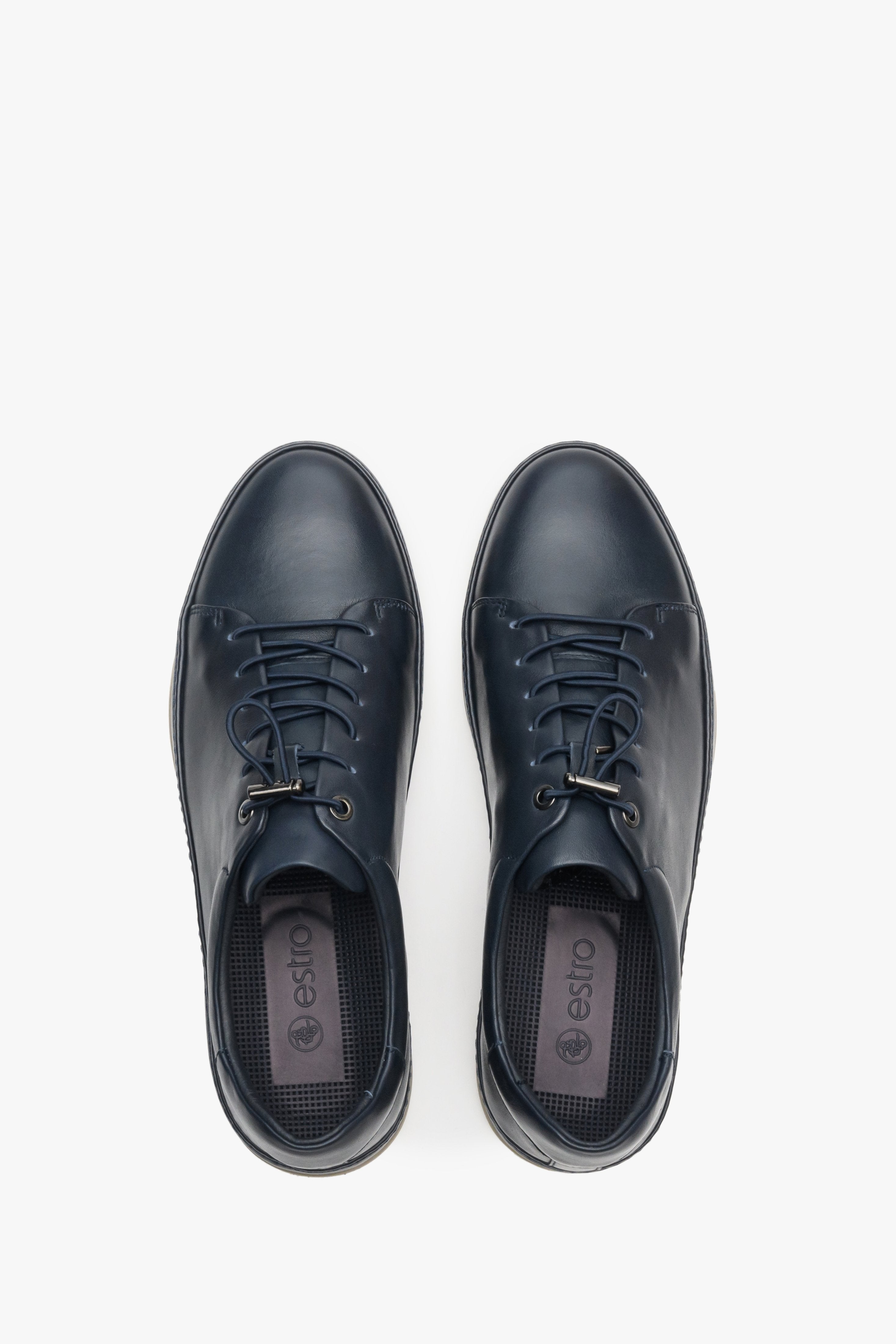 Men's navy blue sneakers made of genuine leather - top view model presentation.