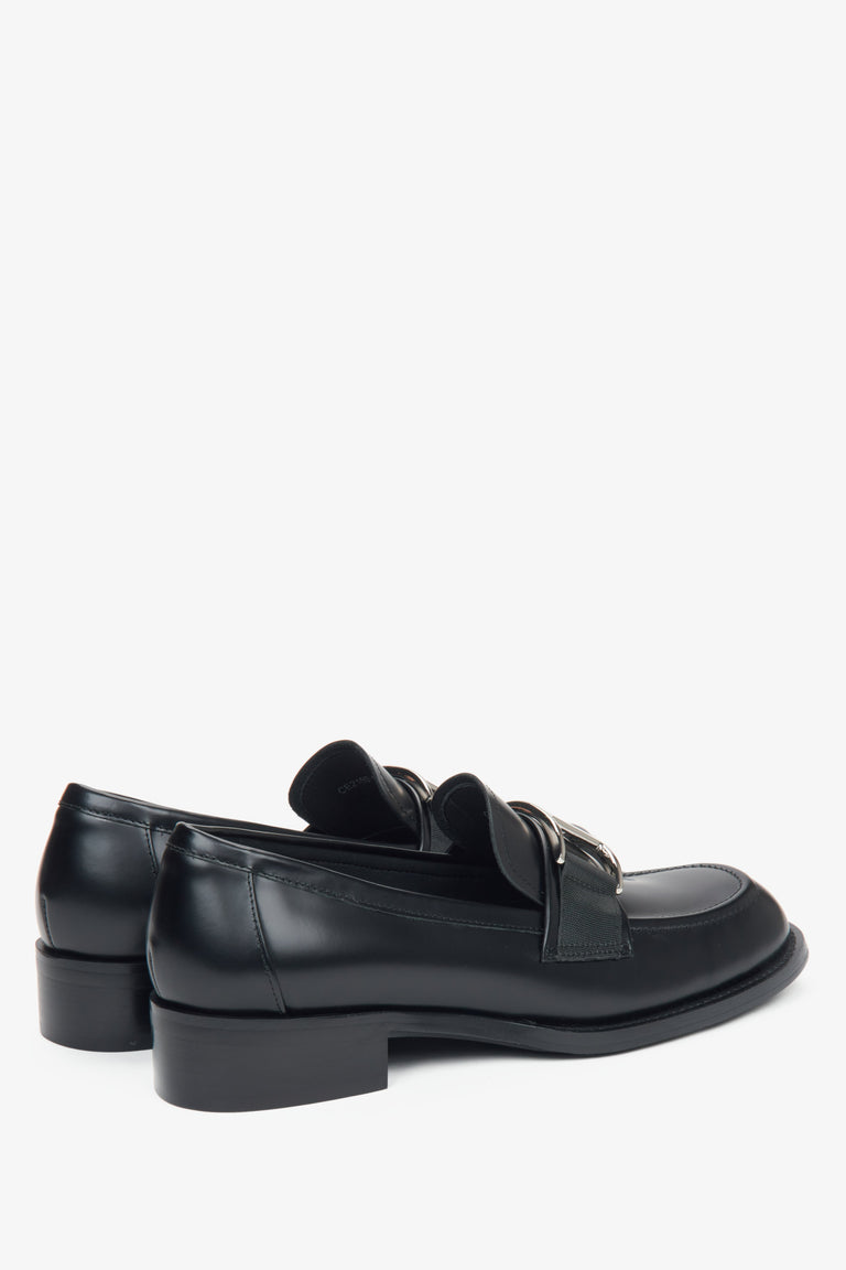 Estro black leather women's penny loafers with a decorative buckle - close-up of the heel.