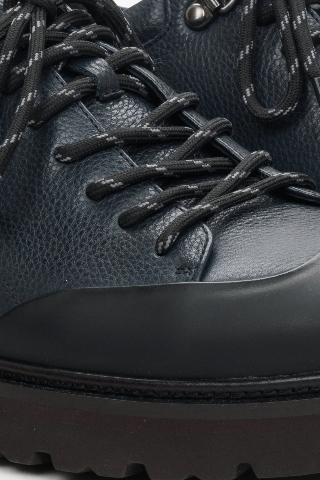 Men's dark blue leather loafers - close-up on the details.