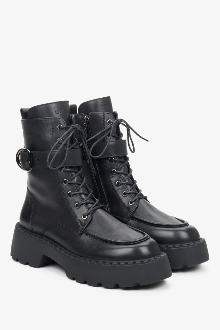 Women's high black leather combat boots by Estro.