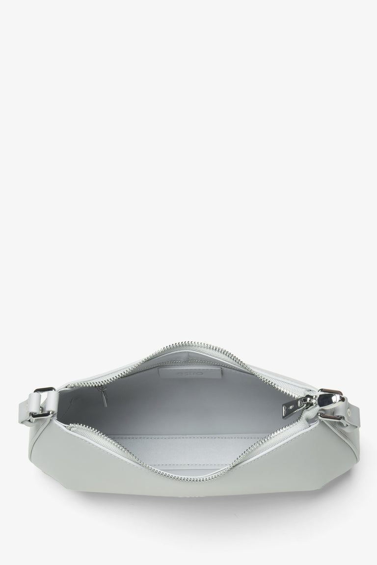 Women's light grey leather handbag - a close-up on the main compartment.