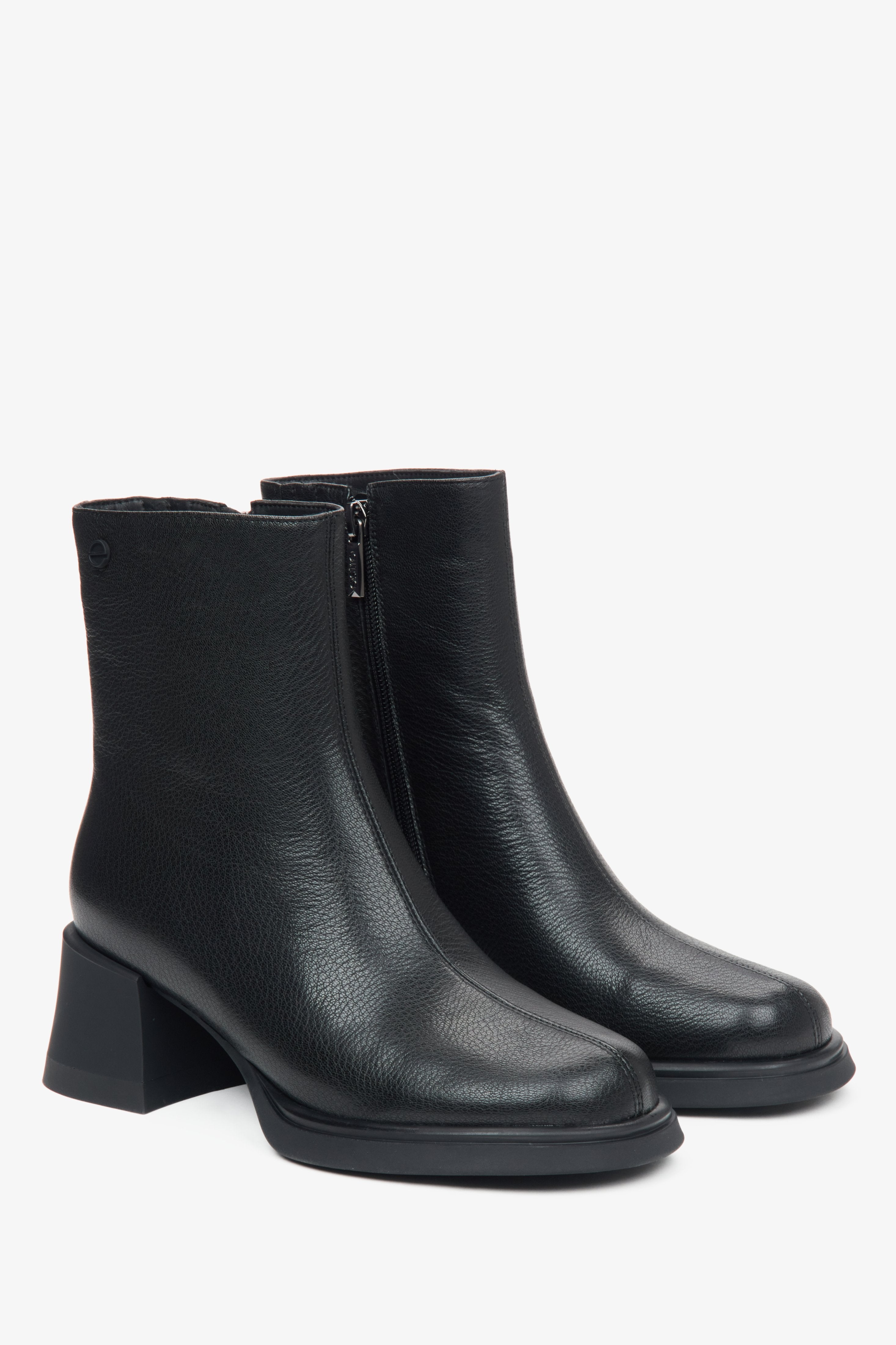 Women's black leather ankle boots by Estro - close-up on the front and side of the boot.