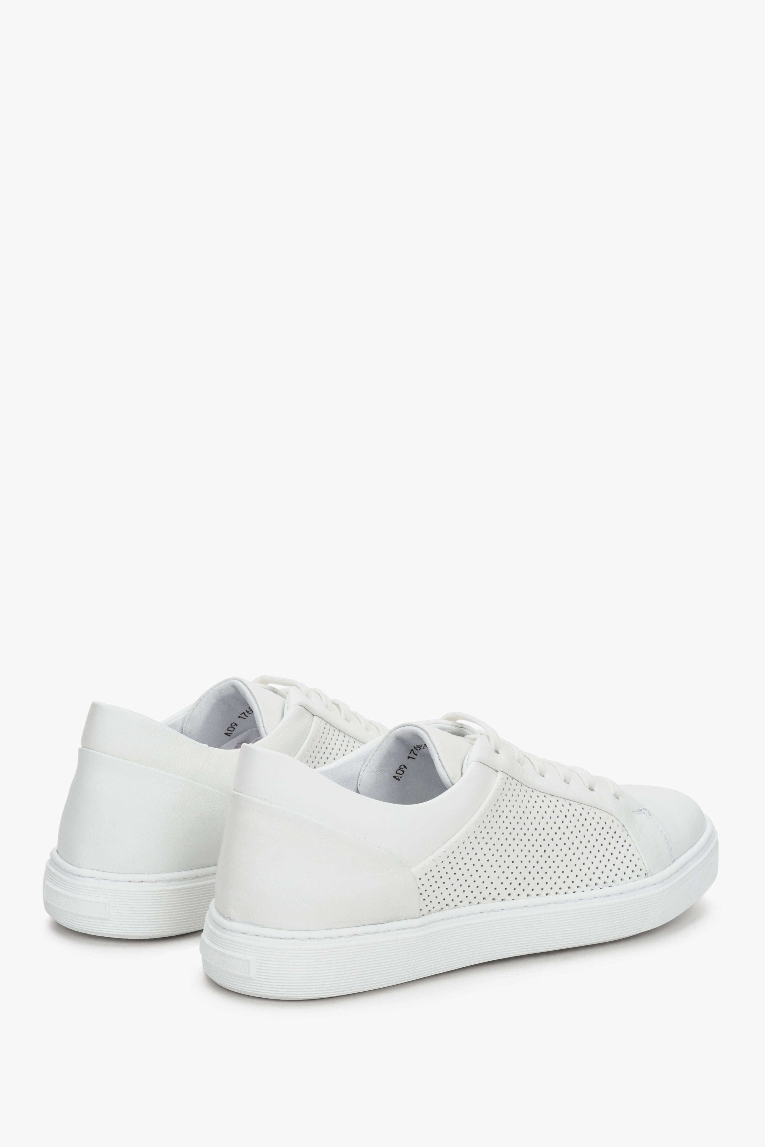 Women's white leather sneakers with perforation by Estro - close-up of the heel and the side of the shoe.