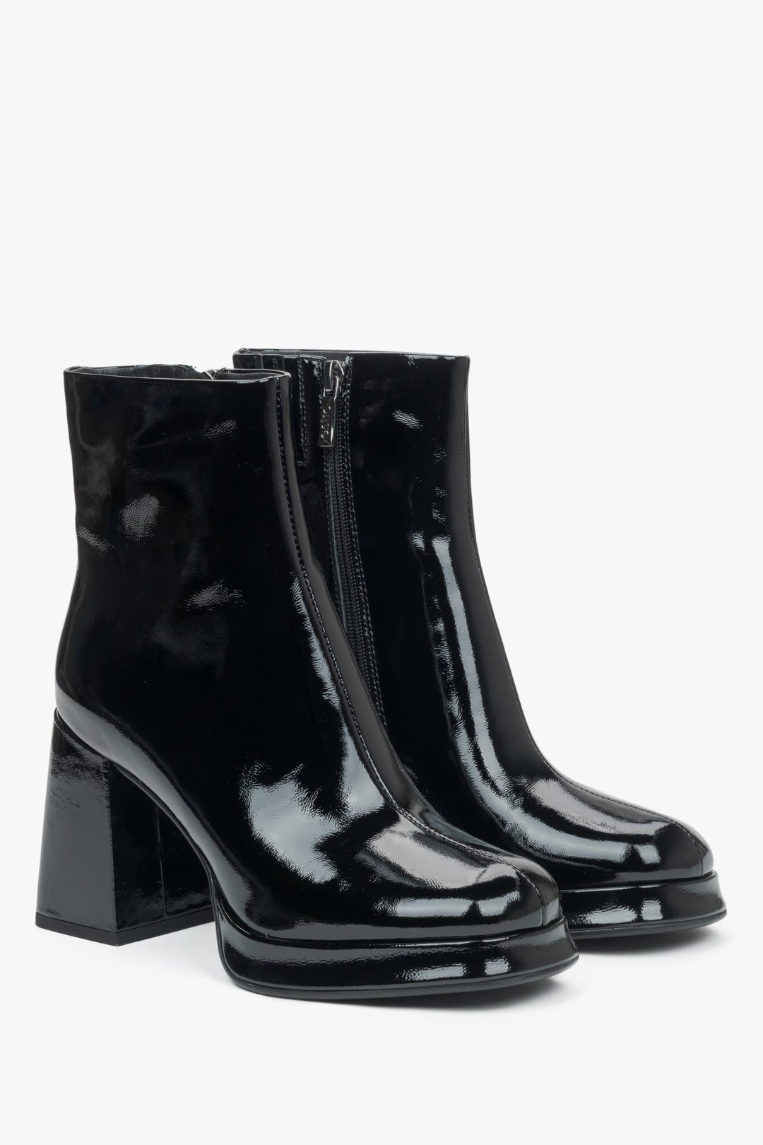 Black patent leather women's ankle boots on a platform with a stable heel by Estro - front and toe of the shoes.