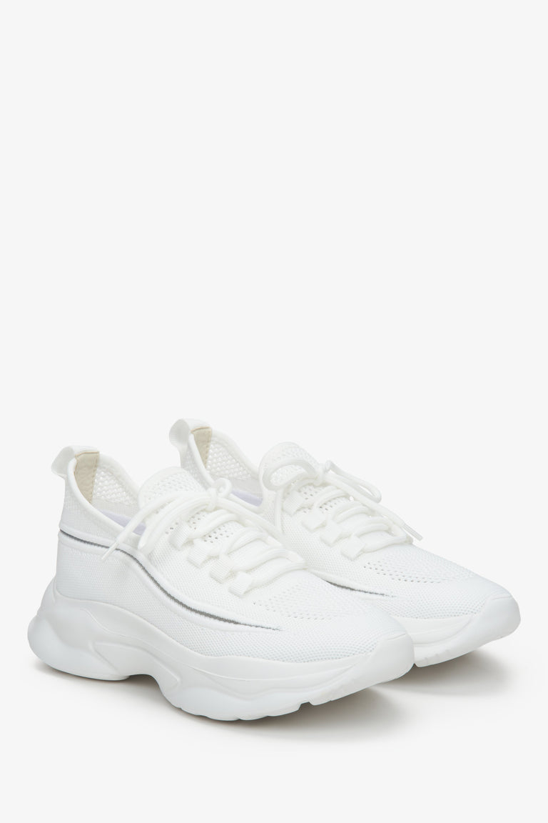 Low-top mesh and textile women's sneakers in white.