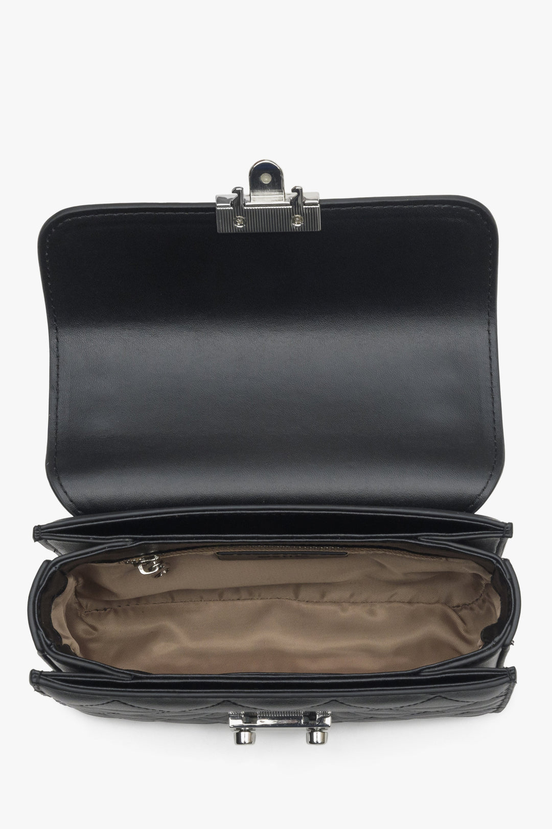Women's black shoulder bag made of genuine leather with silver accents - close-up of the interior of the model.