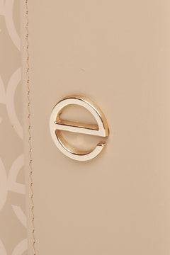 Women's leather tri-fold wallet with golden accents by Estro - close-up on the emblem.