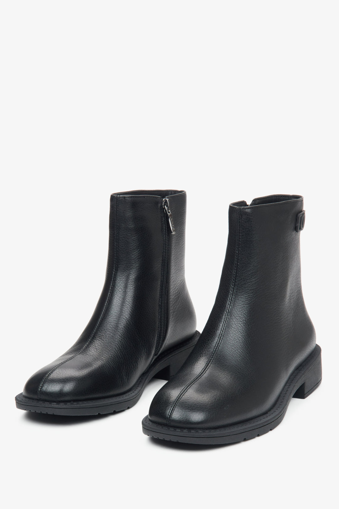 Black women's ankle boots with light insulation made of genuine leather by Estro - front view of the model.