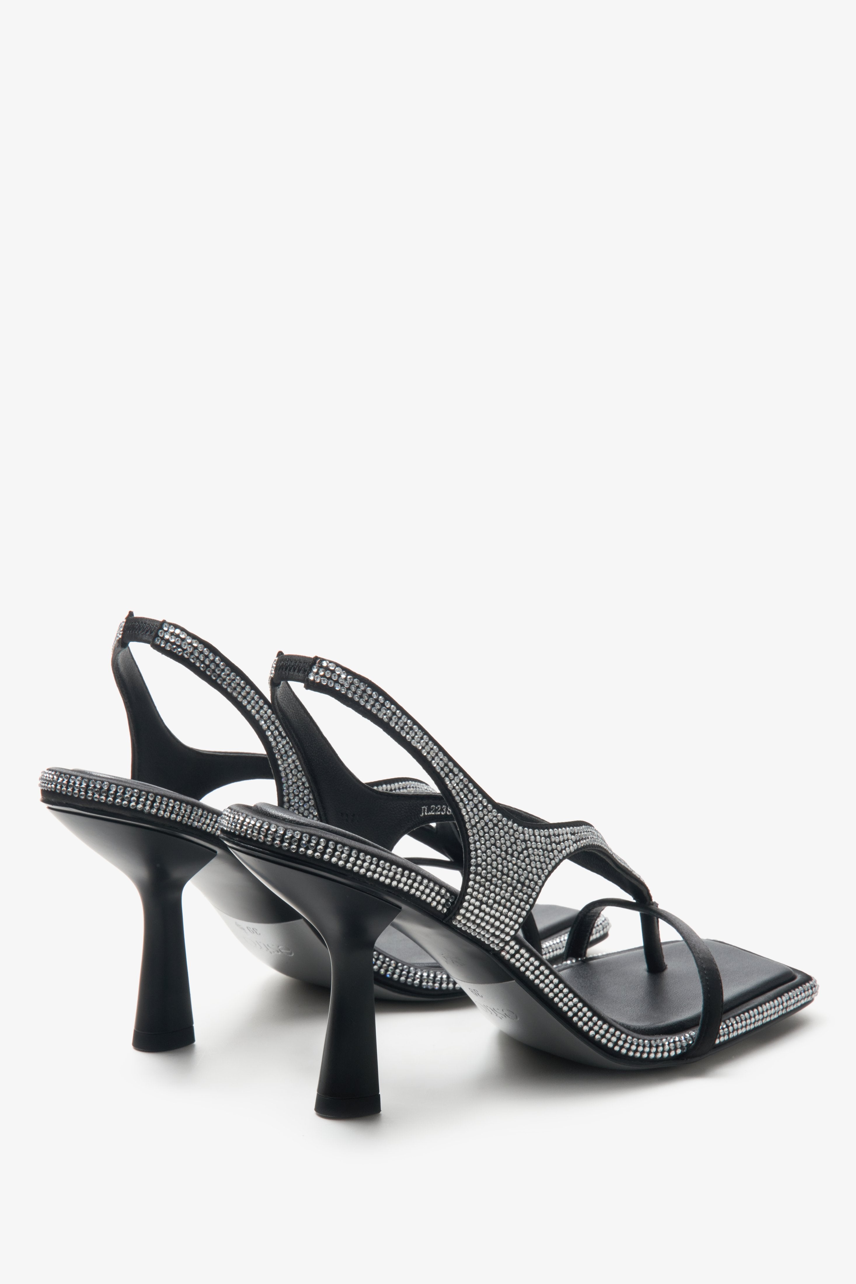 Black leather diamond heeled sandals - a close-up on shoe profile.