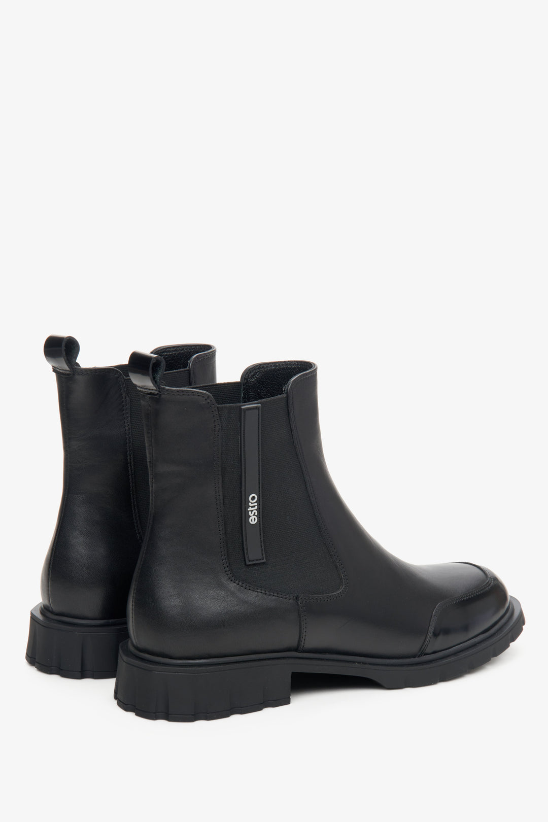 Women's black leather Chelsea boots by Estro - close-up on the side seam and heel counter.