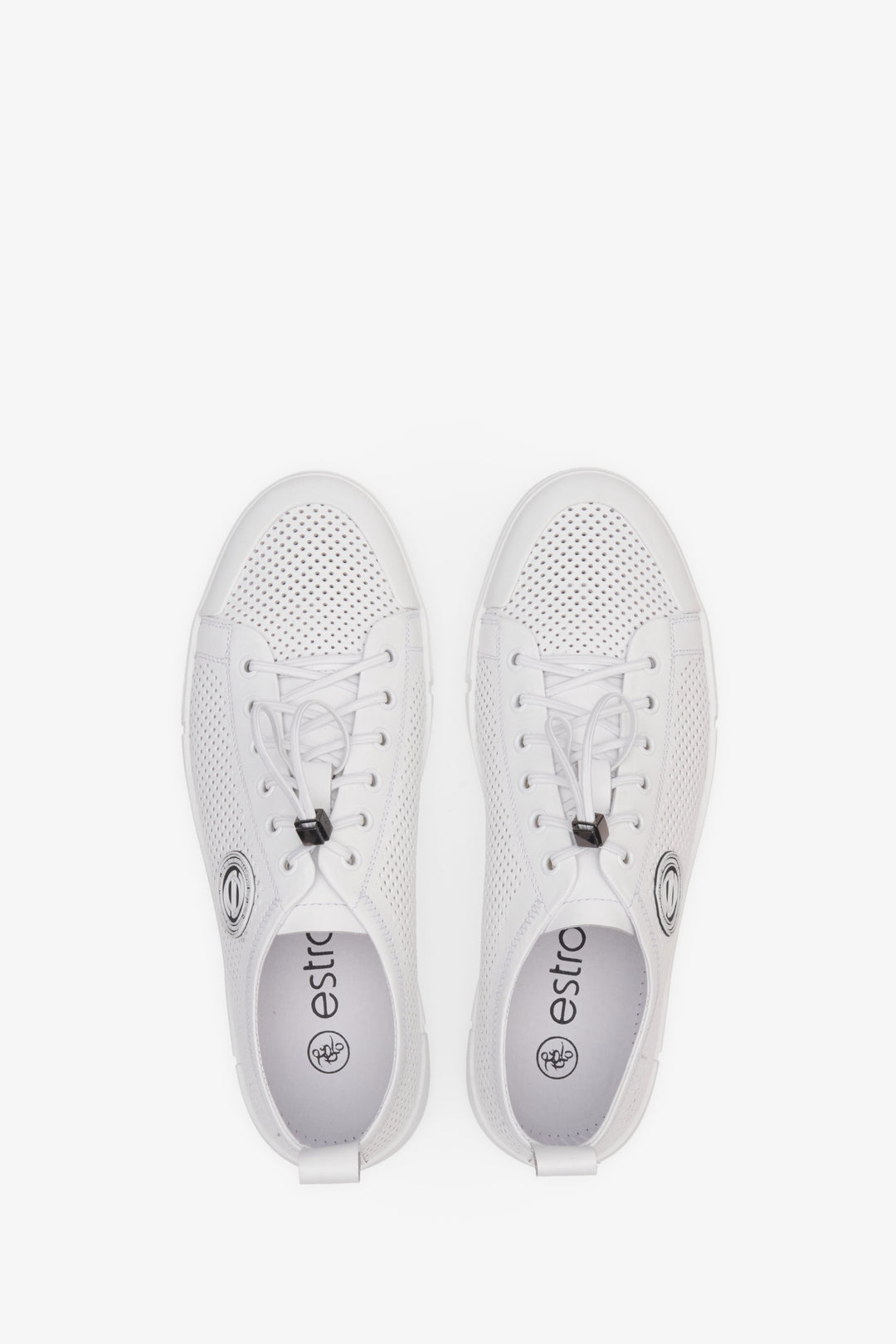 Summer men's sneakers in white made on natural leather - presentation of the shoes from above.