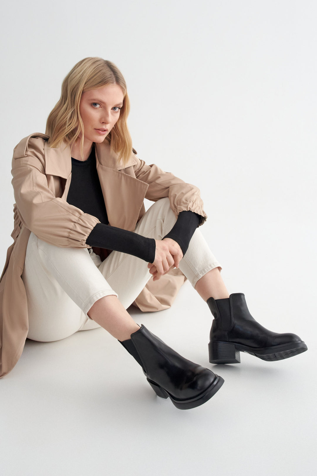 Women's Black Leather Heeled Boots Estro - presentation on a model.