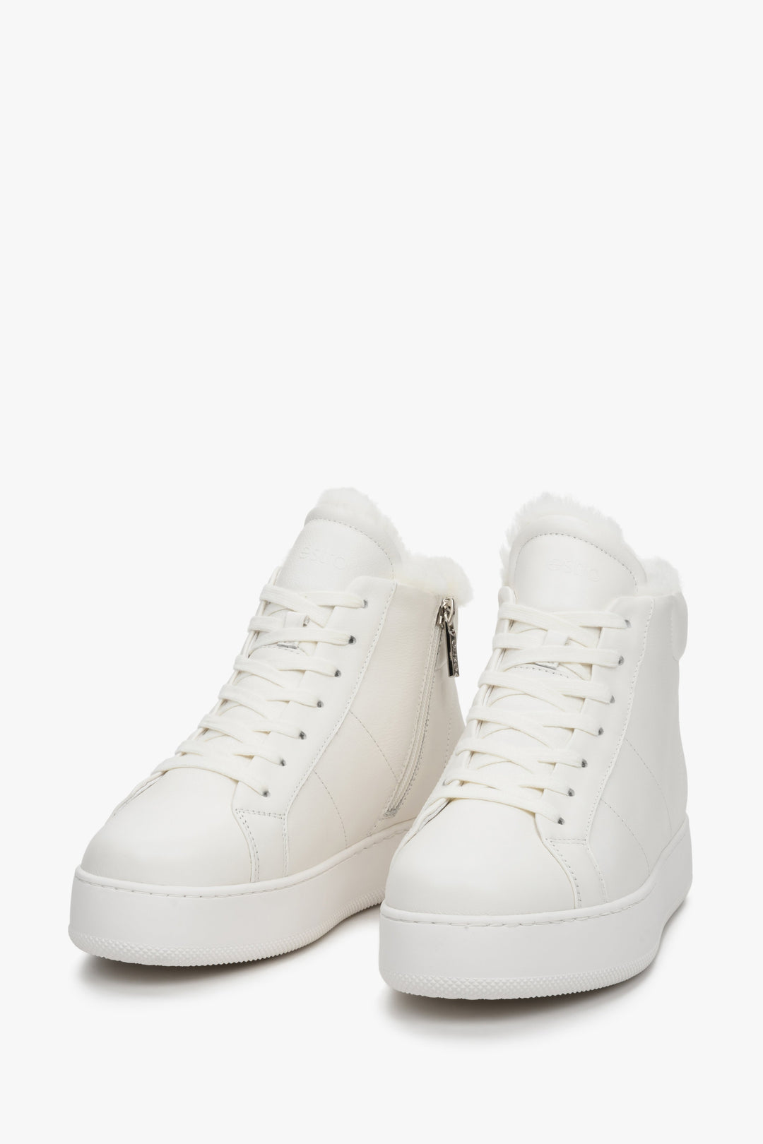 Women's white high-top sneakers made from genuine leather by Estro - close-up on the front of the shoe.