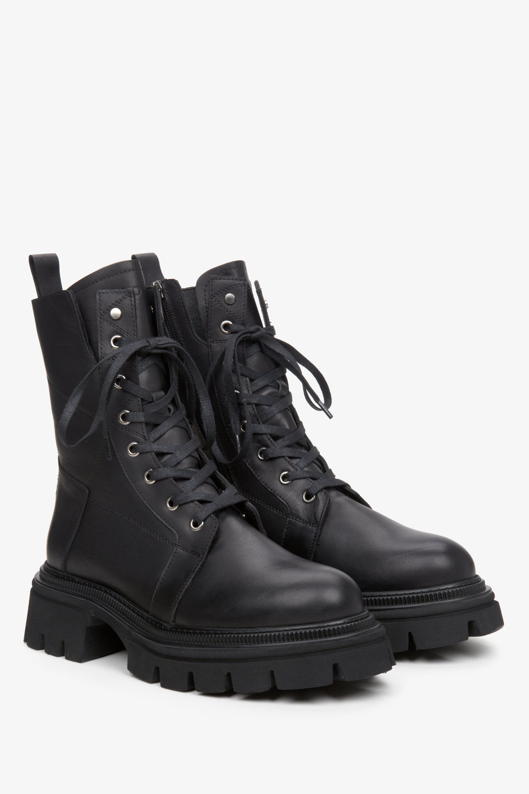 Women's black leather  boots with decorative lacing.