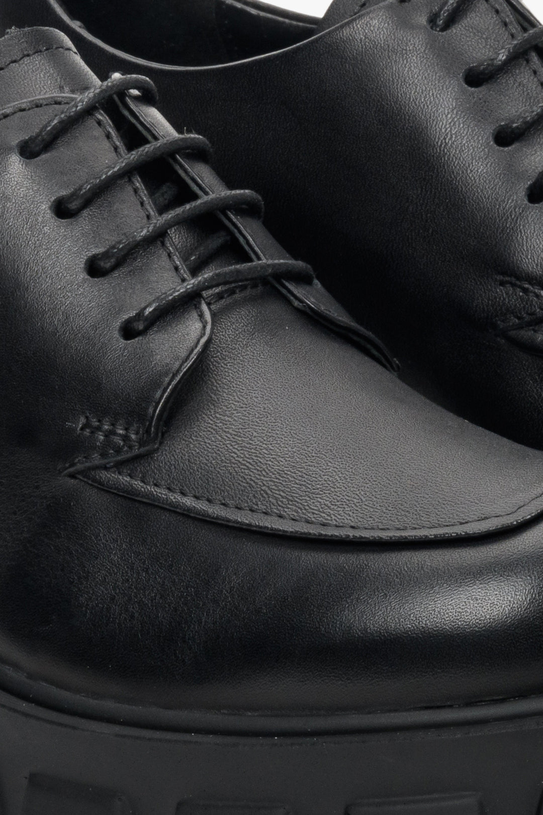 Women's black leather shoes by Estro - close-up on details.