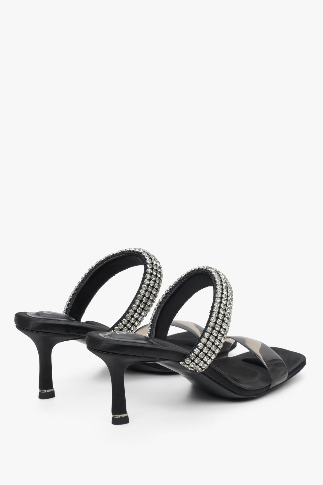 Women's black stiletto slide sandals with zirconia, Estro brand - close-up on heels and heel line.