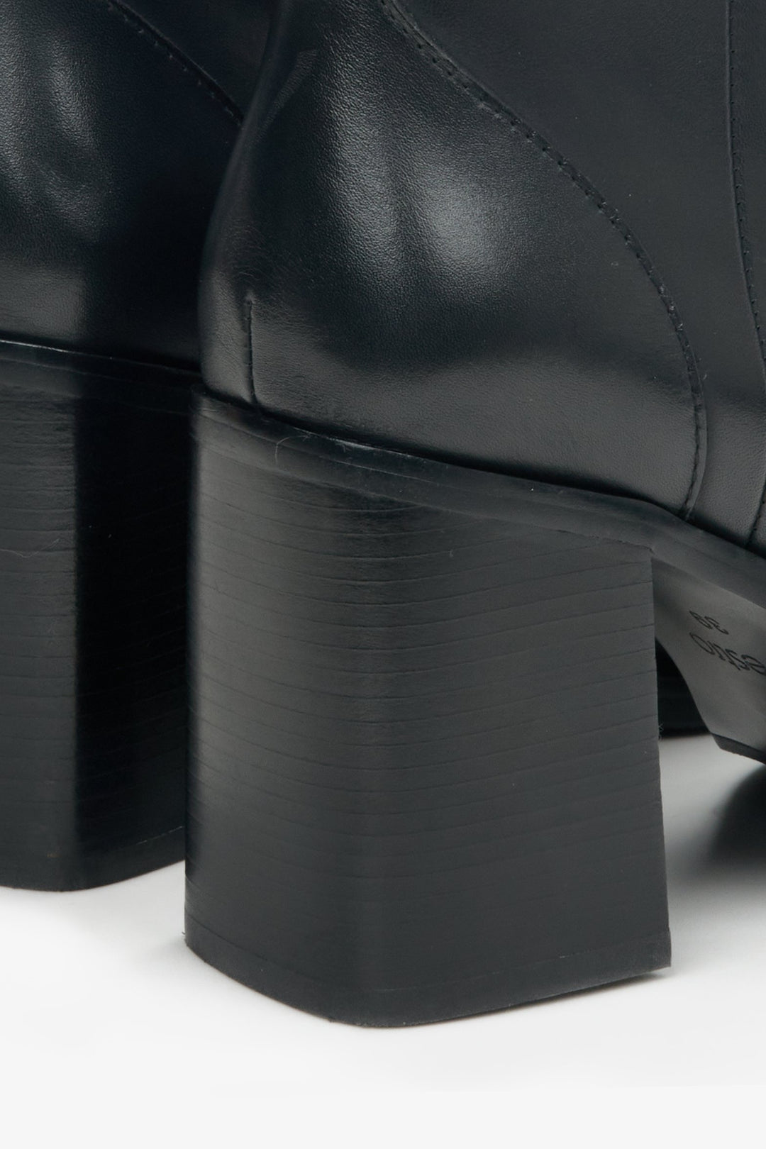 Women's black leather ankle boots with a stiletto heel by Estro - close-up on the heel.