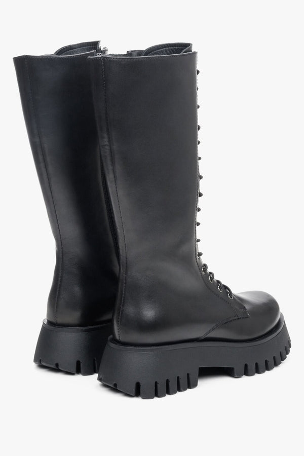 Stylish women's black leather boots with lacing made of genuine leather - presentation of sideline.