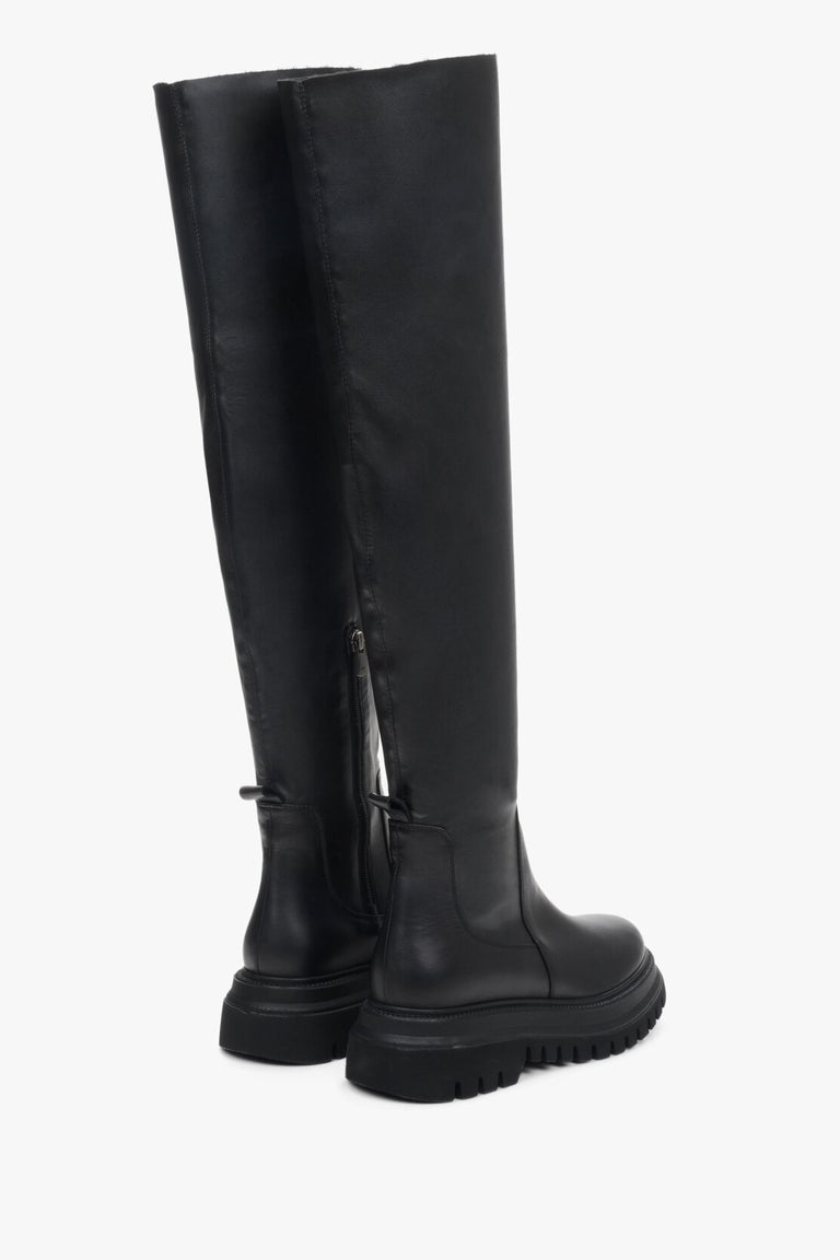 Elegant black women's boots natural leather - presentation of a shoe toe and sideline..