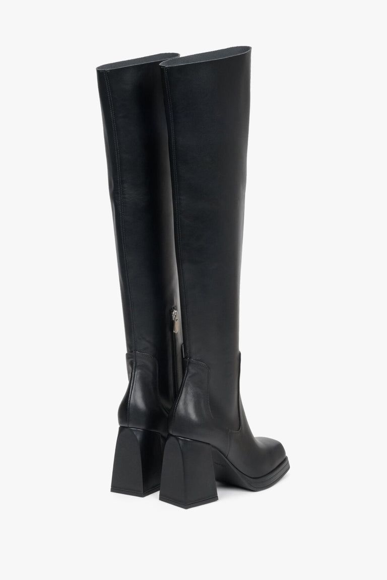 Elegant black women's boots genuine leather - presentation of a shoe toe and sideline.