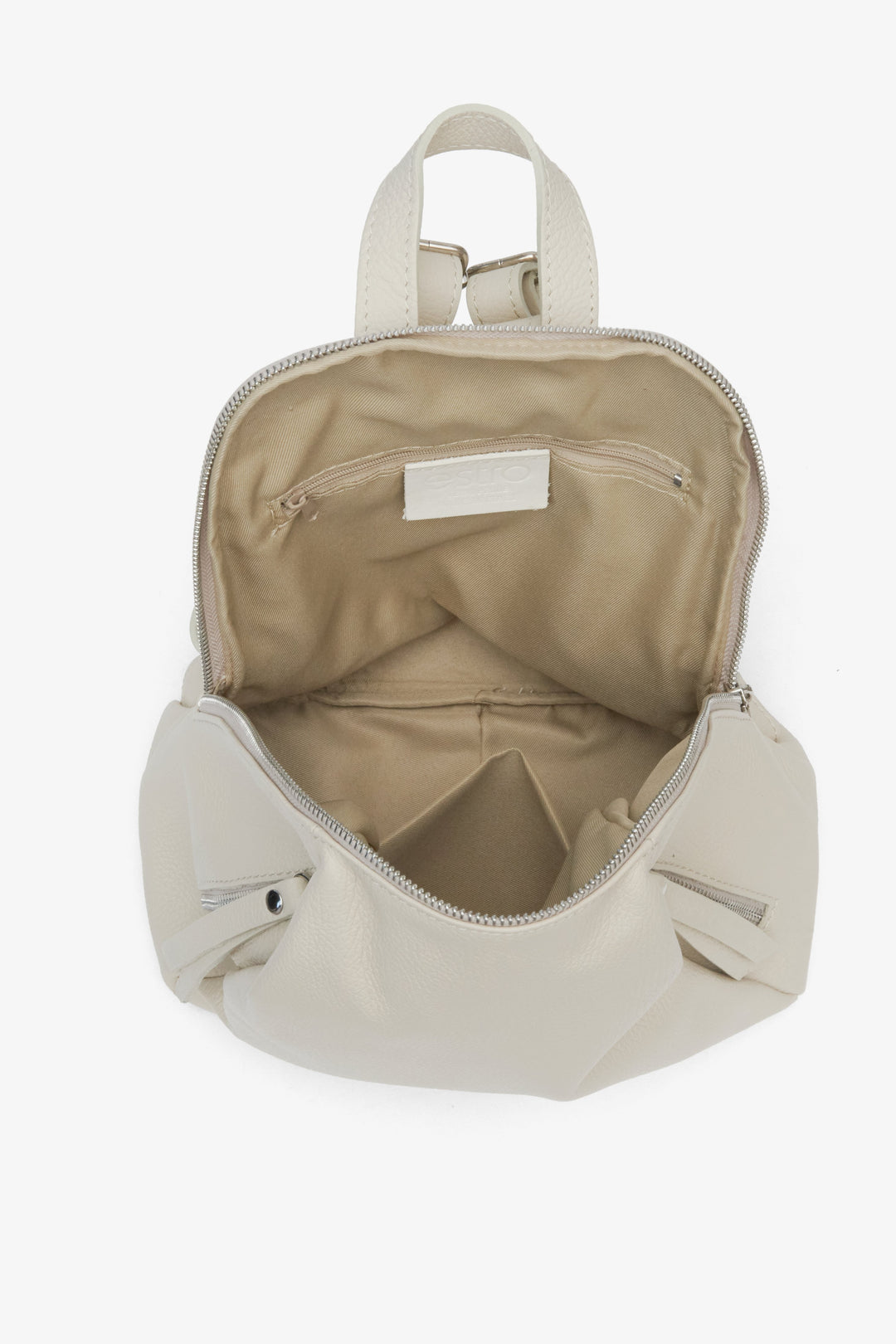 Elegant women's beige leather backpack with silver accents - close-up on the lining.